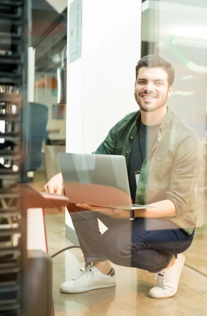 Bluefinch-esbd - bluefinch esbd engineer with laptop hand working datacenter e1776243045514
